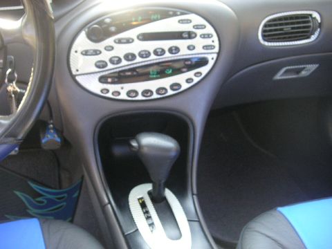 1999 Ford Taurus - Interior view of a 1999 Ford Taurus, highlighting the center console and dashboard details.