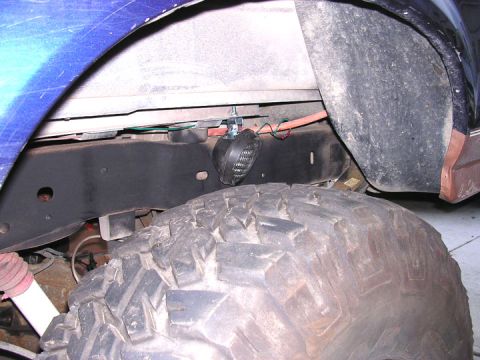 1994 Ford Bronco - rear light, just clears the rear tire without any problems. you can see the rub mark from the tire on the inner fender