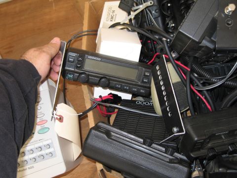 1991 Ford LTD Crown Victoria - A collection of electronic devices, including a Kenwood radio, is piled in a box.