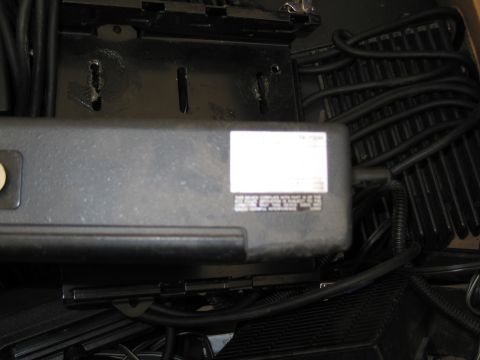 1991 Ford LTD Crown Victoria - A close-up view of a black electronic device a white label with printed text.