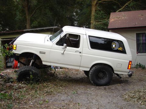 1989 Ford Bronco - This lifted 1989 Ford Bronco features oversized tires and a custom suspension setup, giving it a appearance.