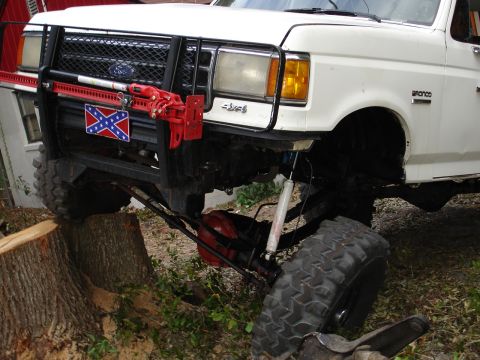 1989 Ford Bronco - This 1989 Ford Bronco is equipped with a bull bar, jack, and large off-road tires.