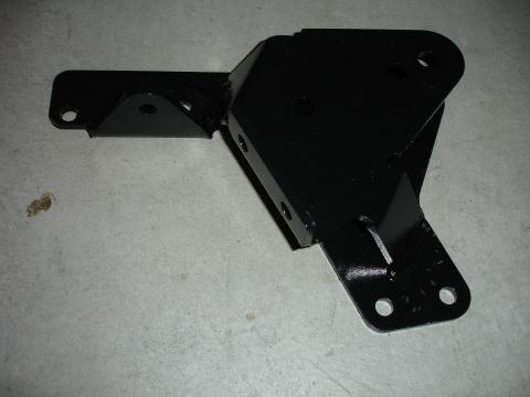 1996 Ford Bronco - A black metal bracket, likely for a vehicle suspension lift kit, is displayed on a gray concrete floor.