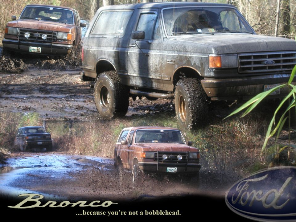 Three Ford Broncos driving through a muddy trail; one is dark gray, one is reddish-brown, and one is dark blue