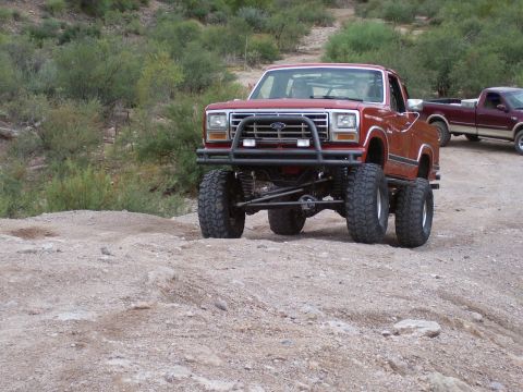 1991 Ford Bronco - This modified red Ford Bronco appears to be from the early 1980s, not 1991.