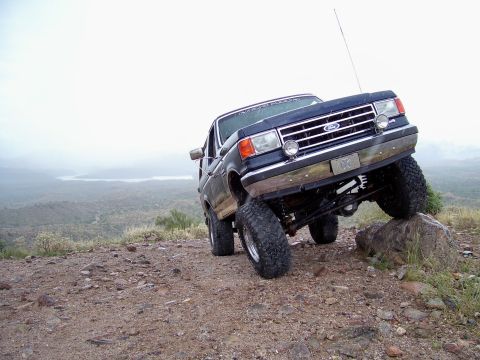 1991 Ford Bronco - This 1991 Ford Bronco is navigating a challenging rocky terrain off-road.