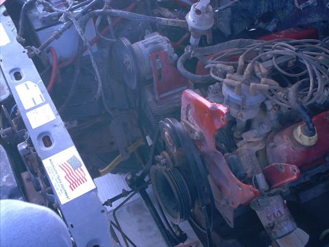 1986 Ford Bronco - Close-up view of an engine bay, a V8 engine and associated parts.