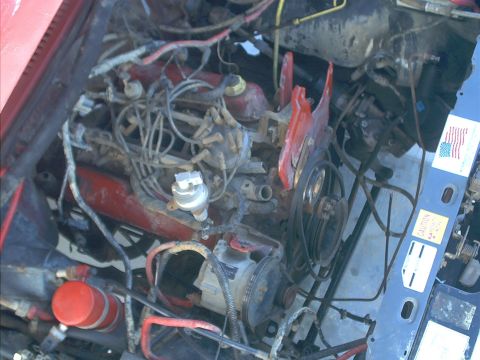 1986 Ford Bronco - Close-up view of a vehicle's engine bay, showing various components and wiring.