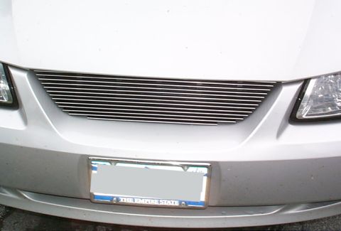 2000 Ford Mustang - A silver car's front end is shown, a custom horizontal chrome grille and a license plate.