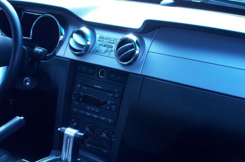 2006 Ford Mustang - The dashboard of a 2006 Ford Mustang features a Shelby Automobiles plaque and chrome accents.