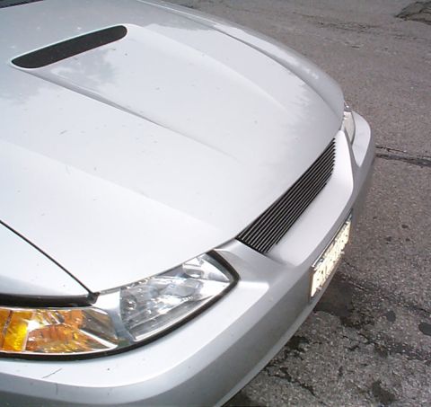 2000 Ford Mustang - Front view of a silver 2000 Ford Mustang, a custom horizontal bar grille and a hood scoop.
