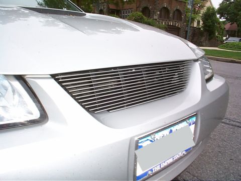 2000 Ford Mustang - The vehicle features a custom horizontal chrome grille and a license plate from The Empire State.