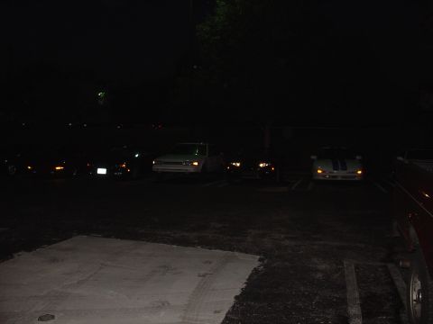 1993 Ford Probe - A 1993 Ford Probe is parked among other vehicles at night.