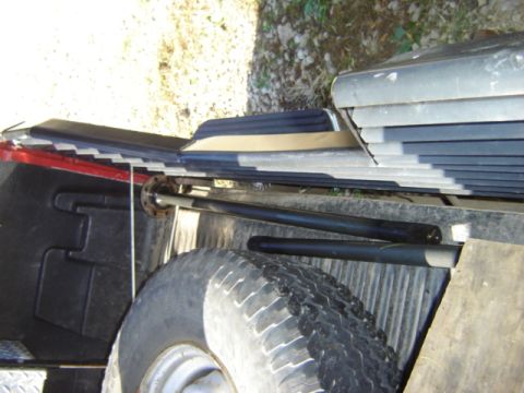 1992 Ford Bronco - Two rear axle shafts are visible, loaded into the bed of a truck.