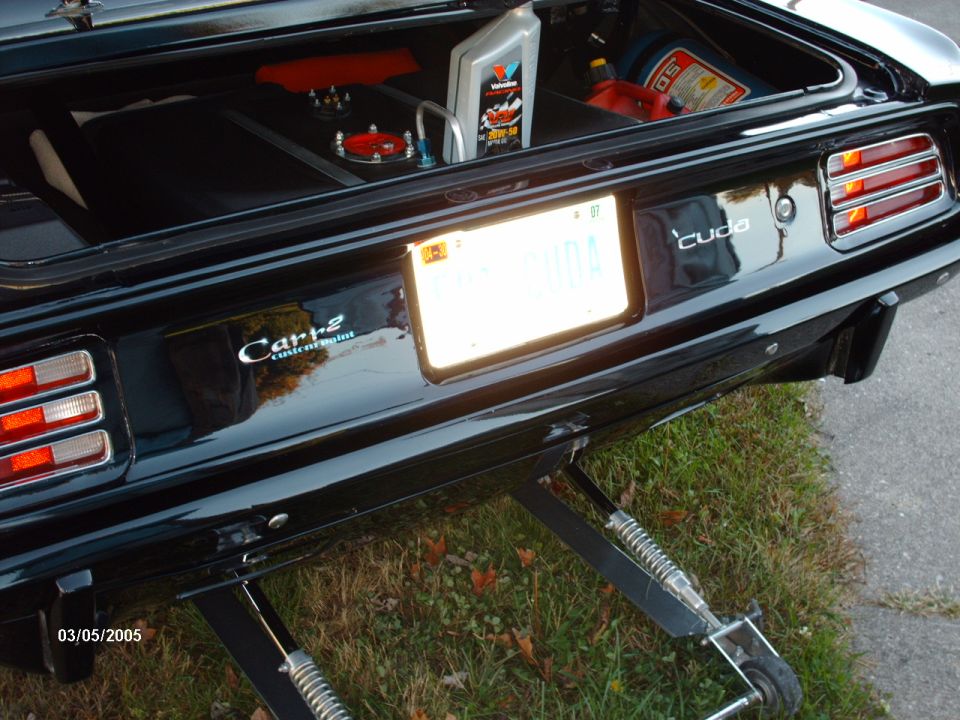 Black 1970 Plymouth Barracuda rear with 'cuda badge and custom trunk setup