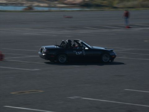2001 Mercury Grand Marquis - Black convertible sports car with racing numbers on track.