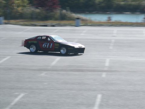 2001 Mercury Grand Marquis - A race car with number 611 is seen on a track during an event.