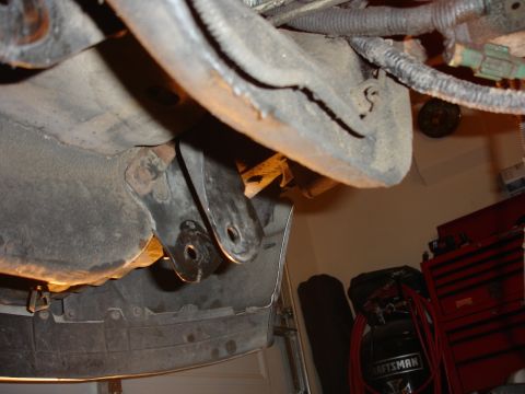 1996 Ford Bronco - Underside view of vehicle suspension components, showing brackets and mounting points.