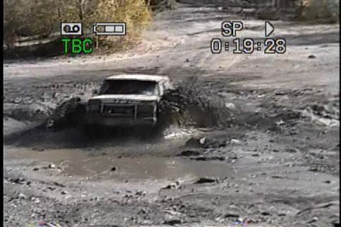 1989 Ford Bronco - This 1989 Ford Bronco is navigating a challenging muddy terrain.