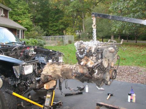 1994 Toyota Tacoma - Engine and transmission removal in progress for a 1994 Toyota Tacoma.