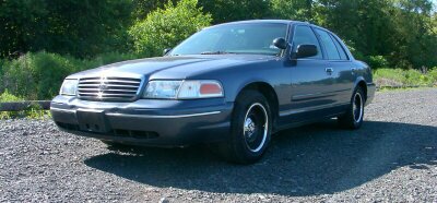 1998 Ford Crown Victoria - With trim rings and Type 170 center caps.