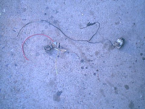 1983 Ford Bronco - Here is the driver side head light where they tapped into to get power for the running lights.