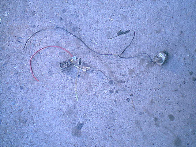 Here is the driver side head light where they tapped into to get power for the running lights.