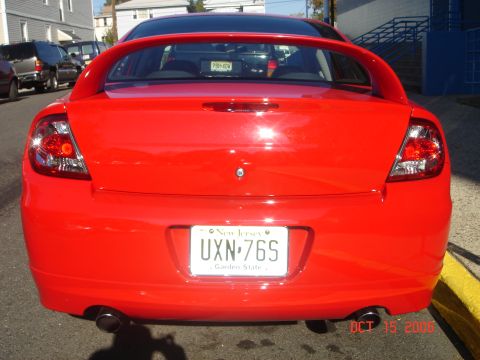 2005 Dodge SRT-4 - Rear view of a red Dodge Neon SRT-4, a prominent spoiler and New Jersey license plates.