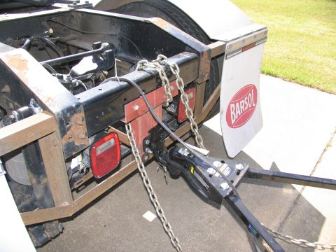 1988 Ford C-350 (Centurion Conversions) - The rear hitch assembly and mud flap are visible on this truck, with the "BARSOL" logo on the flap.