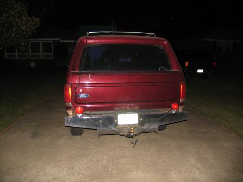 1988 Ford C-350 (Centurion Conversions) - This 1988 Ford C-350 (Centurion Conversions) is seen from the rear, equipped with a camper shell.