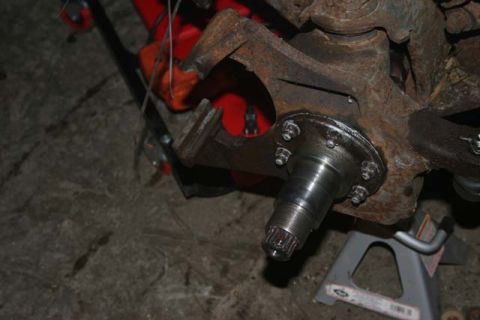 1987 Ford Bronco - Vehicle suspension part, likely from a truck or SUV, undergoing maintenance or repair.