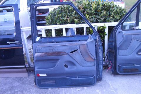 1988 Ford E250 - Detached van doors, likely for a Ford E-Series, are shown for sale.
