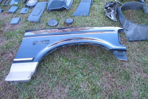 1988 Ford E250 - This blue fender with chrome trim and E-250 badging is a part from a 1988 Ford E250.