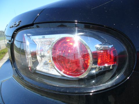 1991 Ford Probe - Detail of a car's taillight assembly, showing red and clear lenses with chrome accents.