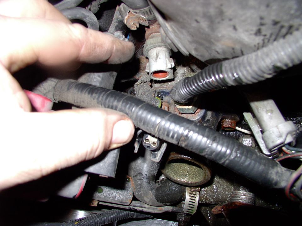 Pull off the coolant temp sensor plug for better access as well. I had to clock mine slightly different from stock to allow the extra temp sensor into the aftermarket T-stat housing (it's for my Taurus electric fan).