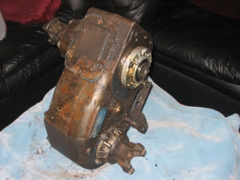 1991 Ford Bronco - A heavily used and dirty transfer case is shown, likely removed from a vehicle.