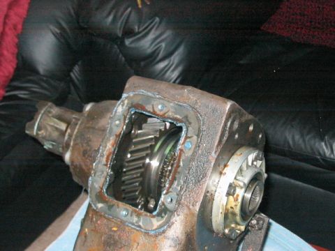 1991 Ford Bronco - Close-up view of a vehicle's transfer case, revealing the intricate gear system within.