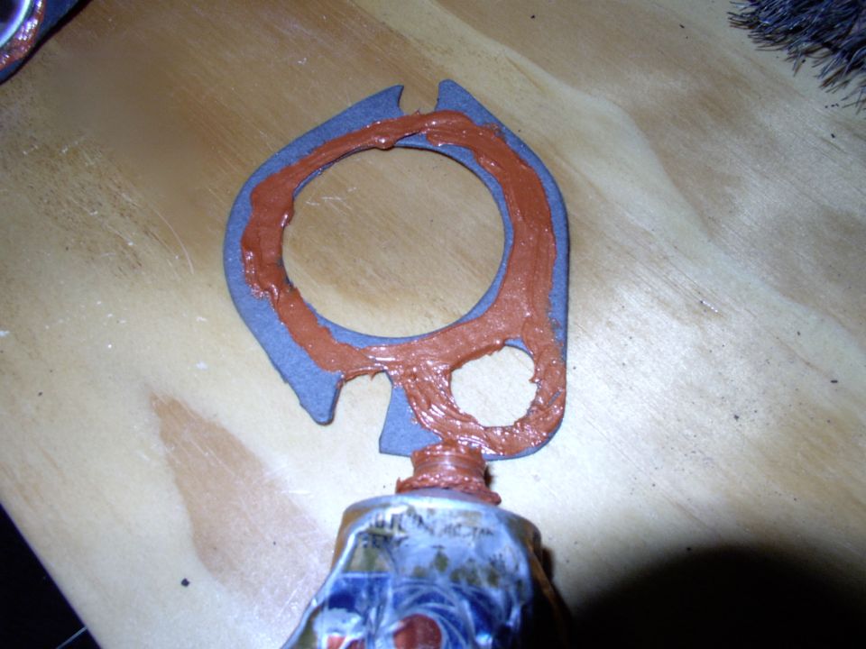 On goes more sealant onto the gasket.