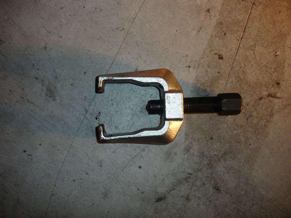 ball joint separator tool on concrete floor
