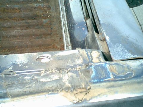 1983 Ford Bronco - here was the rear bolt. it is a flat slice of steel in a pocket. i could not remove it so i tapped a new 8mm hole.