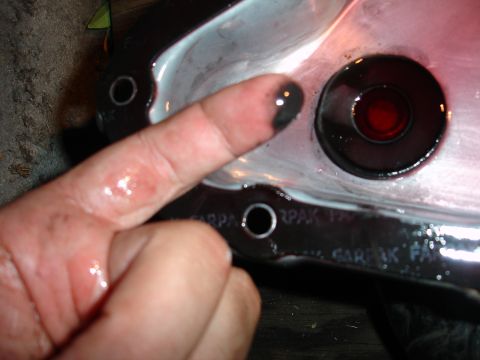1993 Ford Taurus - Checking transmission fluid condition by examining residue on a finger.