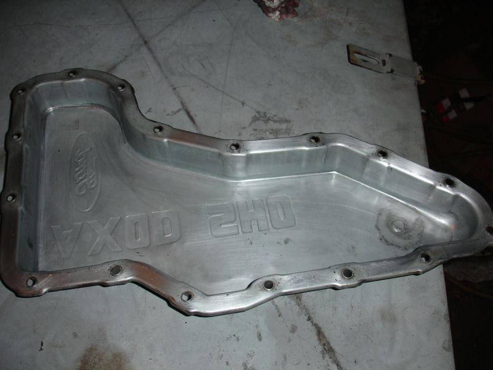 Aluminum oil pan with "Ford" logo and "VXOD 2H0" embossed