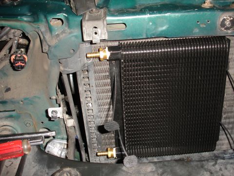 1993 Ford Taurus - Aftermarket transmission cooler installed in front of the radiator.