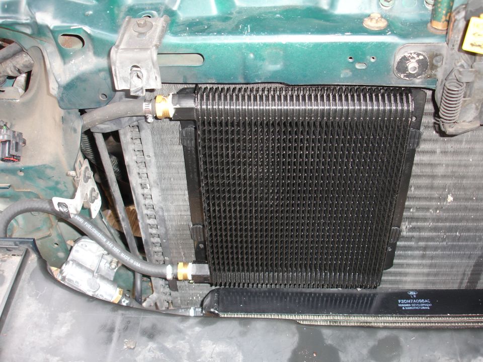 Close-up of a transmission cooler installed in front of a radiator