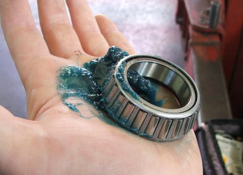 1985 Ford Crown Victoria LTD - Greasing a tapered roller bearing for automotive maintenance.