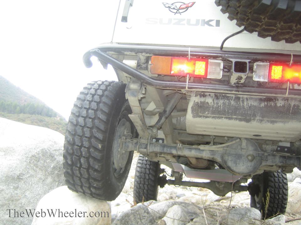 1987 Suzuki Samurai rear axle and tires on rocks, off-road