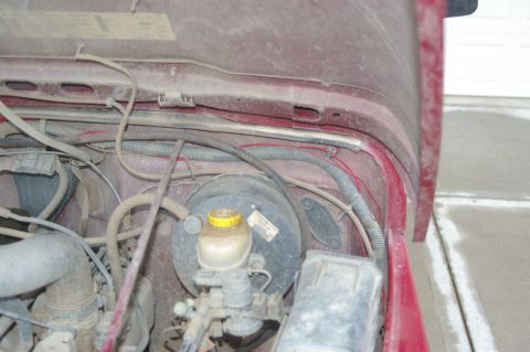 1998 Jeep TJ - Close-up view of the engine bay of a 1998 Jeep TJ, highlighting the brake booster and master cylinder assembly.