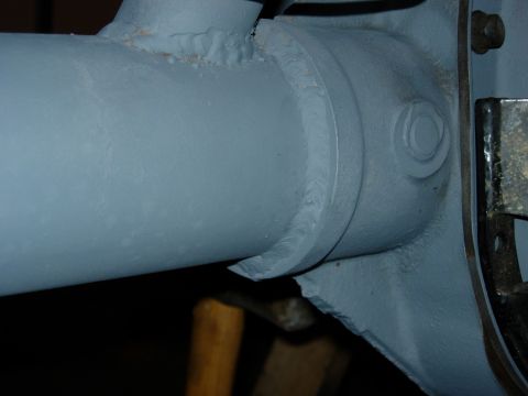 1995 Ford Bronco - Close-up view of a painted axle housing, showing weld details and a bolt head. The registry label of 1995 Ford Bronco is not supported by t…