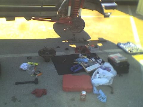 1989 Ford Bronco - Replacing passenger bearing in AutoZone's parking lot in Hollister.