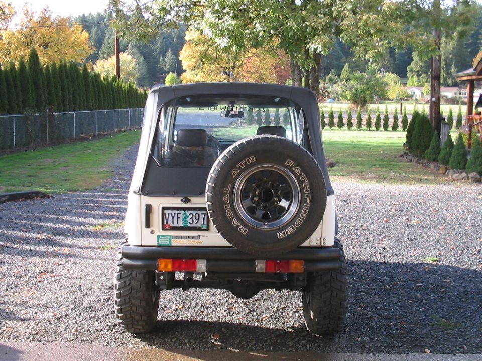 1987 Suzuki Samurai rear view with spare tire mounted on back